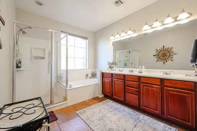 a bathroom with a sink a vanity and a mirror