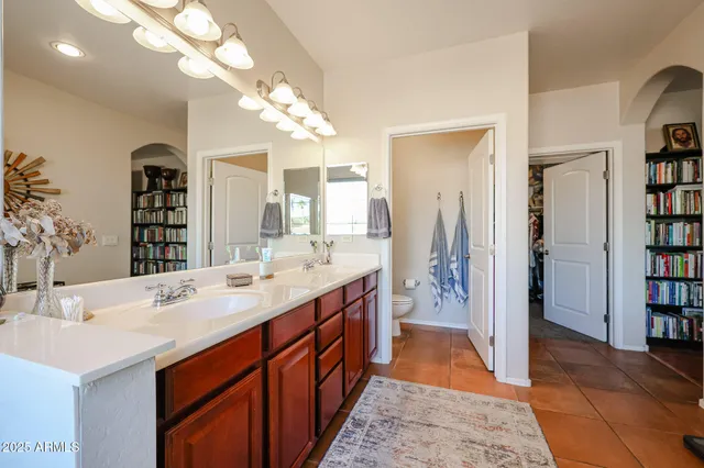 a bedroom with furniture and a window
