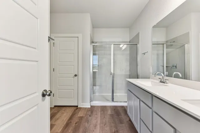a bathroom with a sink a toilet and with mirror