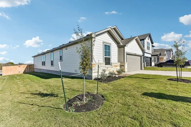 a kitchen with stainless steel appliances granite countertop a sink and stove top oven