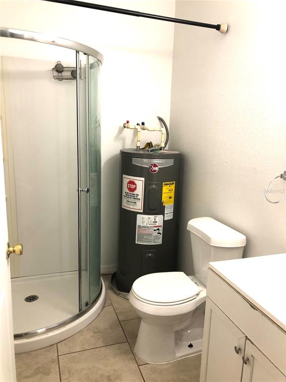 110 Forest Avenue, Unit 10 Davenport, FL 33837 - Photo 7 of 7 a bathroom with a toilet and a shower