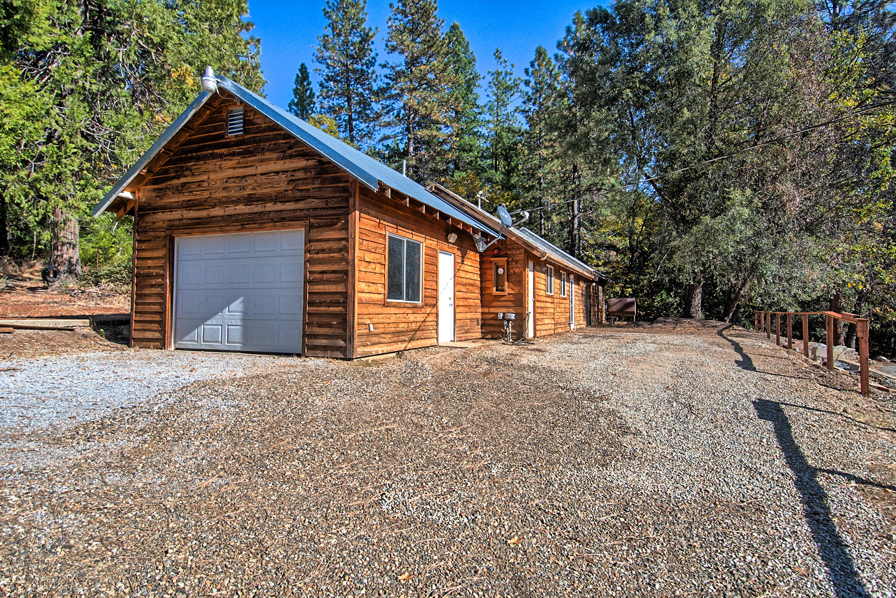 14681 Fern Road Whitmore, CA 96096 - Photo 1 of 37 a front view of house with a yard and garage