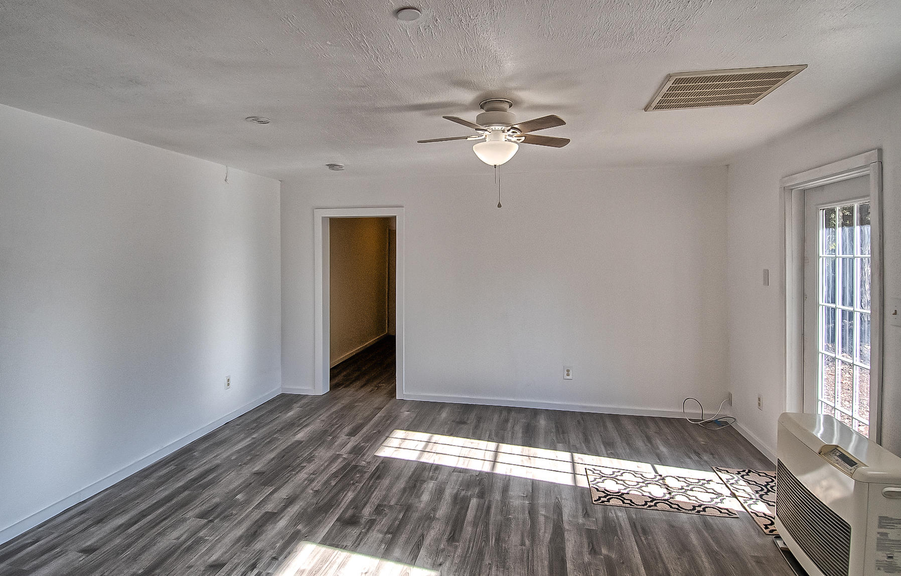 14681 Fern Road Whitmore, CA 96096 - Photo 14 of 37 wooden floor in an empty room with a window