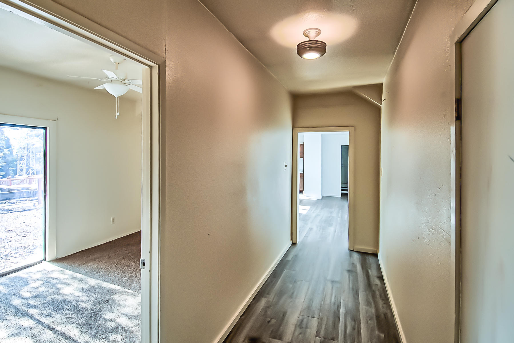 14681 Fern Road Whitmore, CA 96096 - Photo 23 of 37 a view of a hallway with wooden floor and a bathroom