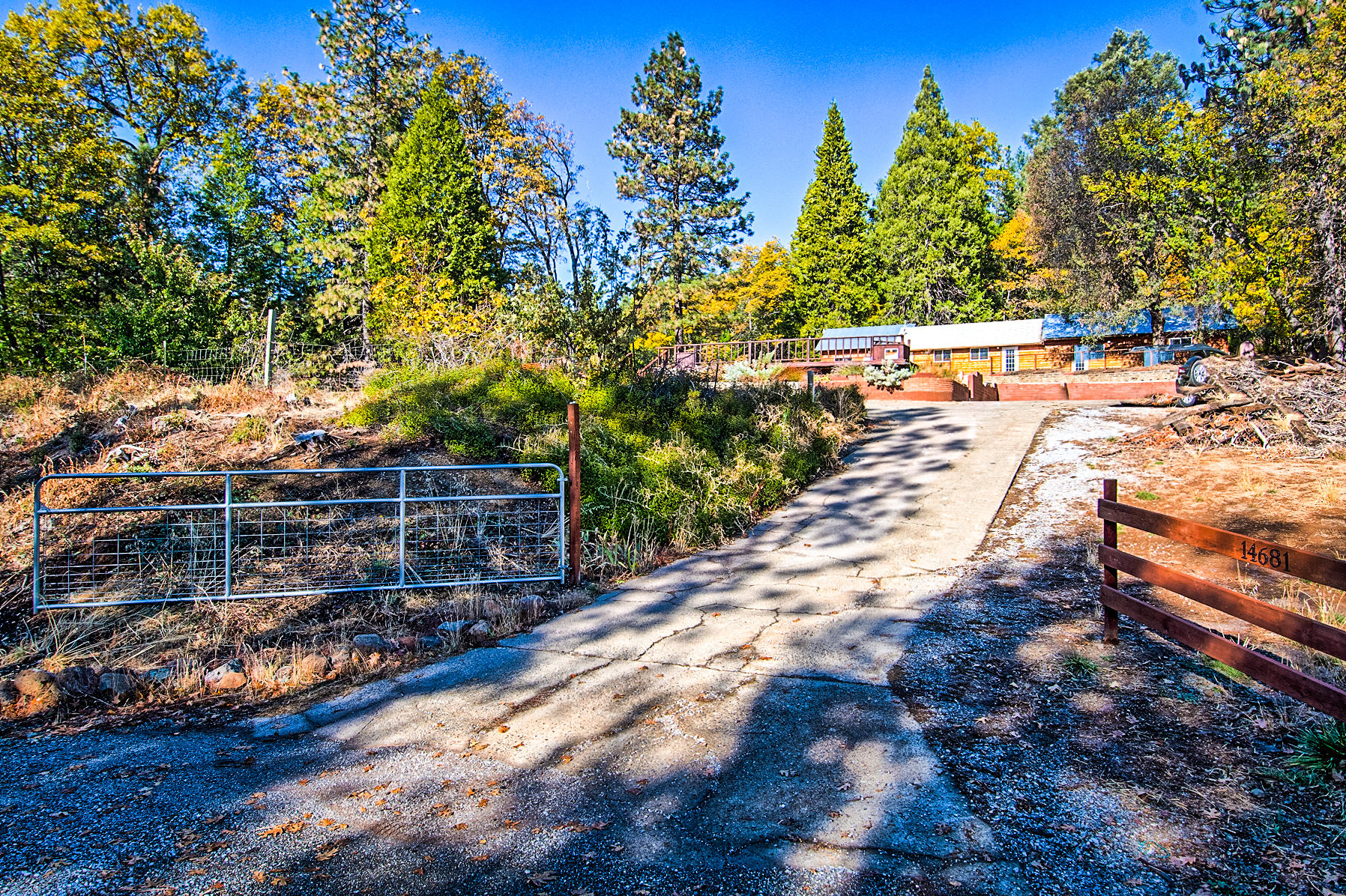 14681 Fern Road Whitmore, CA 96096 - Photo 3 of 37 a view of a yard with wooden fence