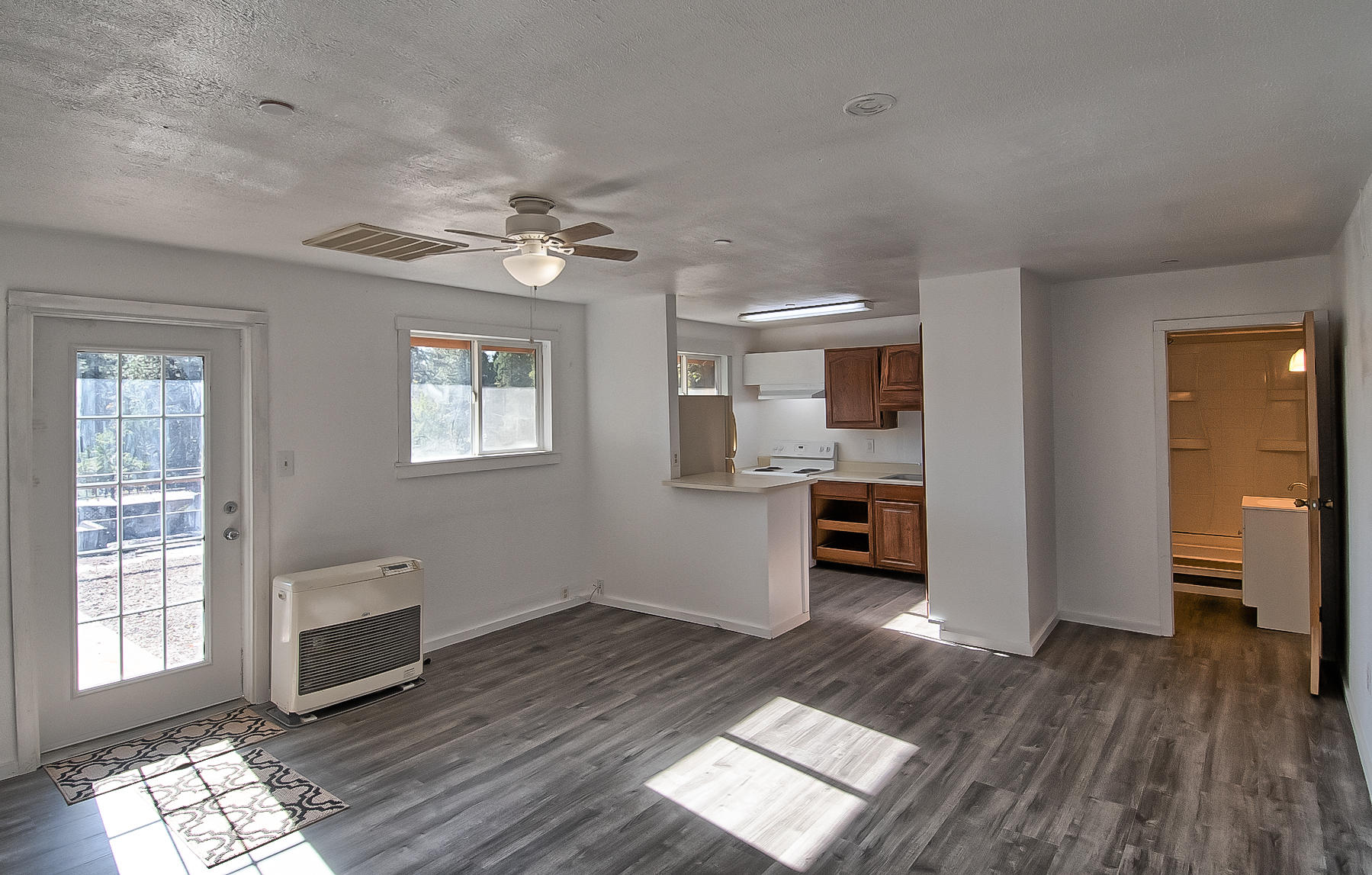 14681 Fern Road Whitmore, CA 96096 - Photo 7 of 37 a view of livingroom with hardwood floor and a ceiling fan