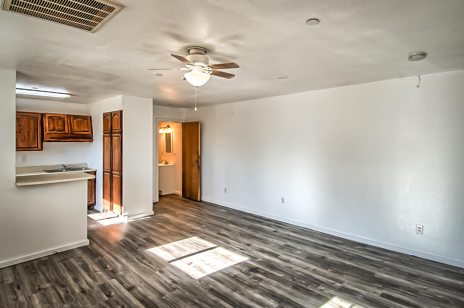 14681 Fern Road Whitmore, CA 96096 - Photo 9 of 37 a view of empty room with wooden floor and fan