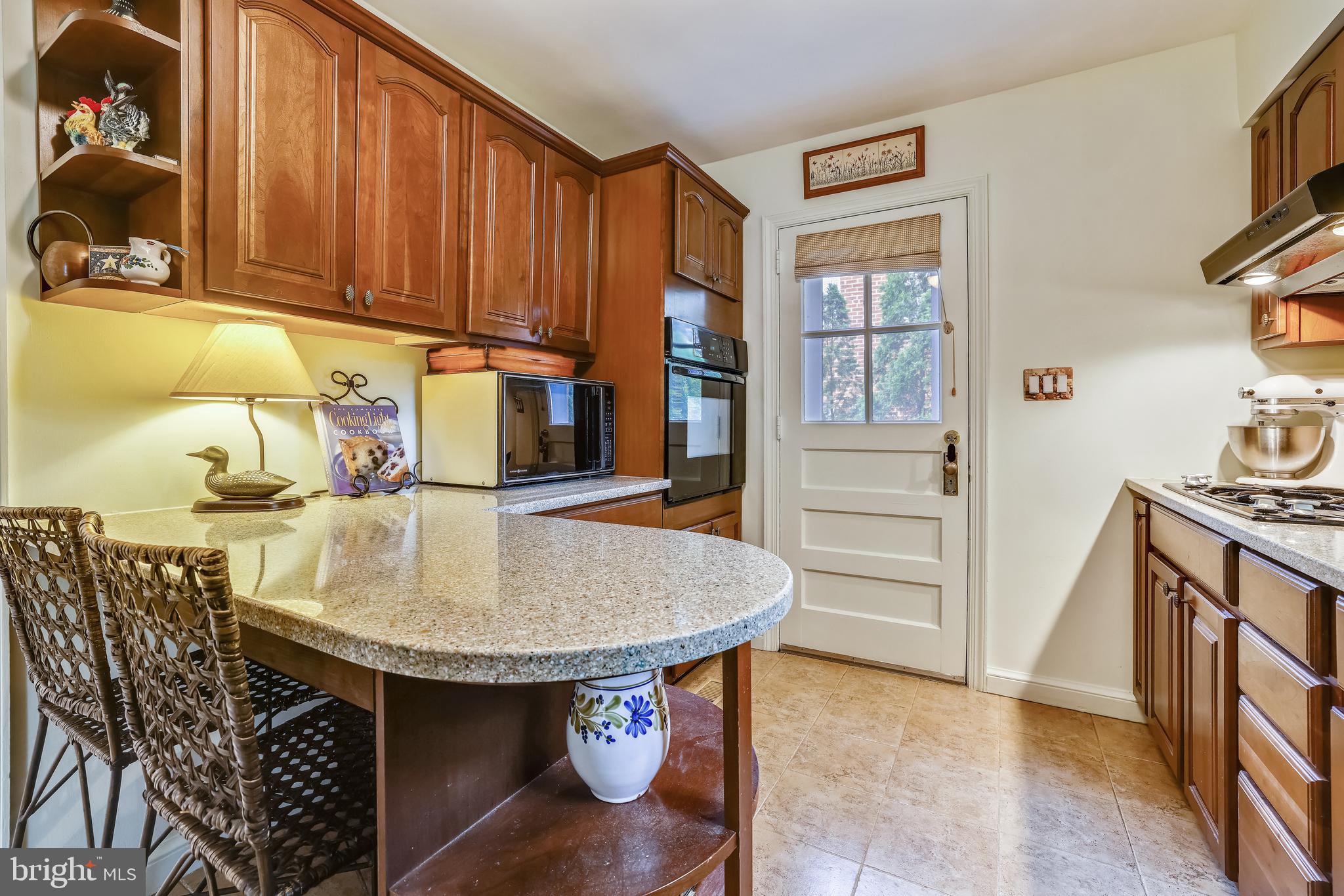 1021 Forest Glen Road Silver Spring, MD 20901 - Photo 9 of 25 Kitchen with peninsula with bar seating