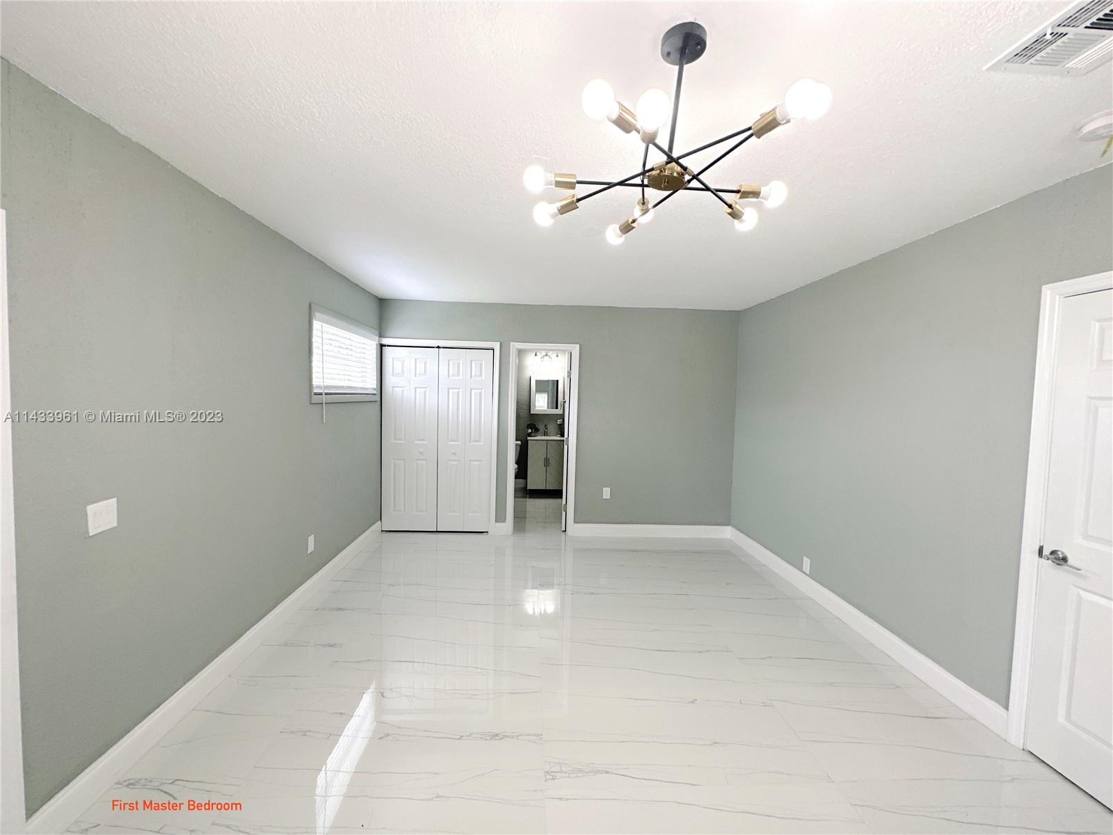 1460 Southwest 3rd Terrace Deerfield Beach, FL 33441 - Photo 39 of 100 a view of an empty room with a window
