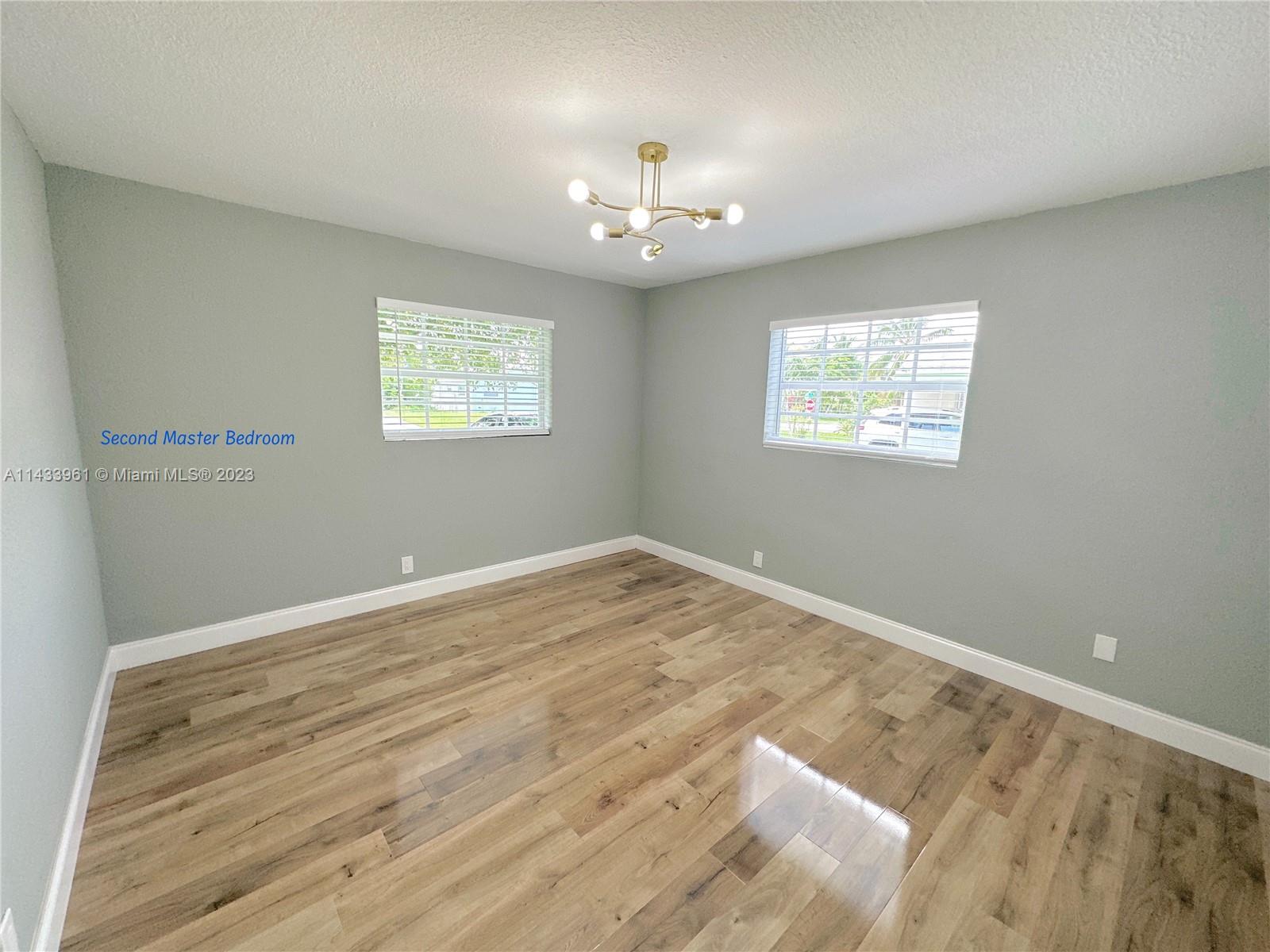 1460 Southwest 3rd Terrace Deerfield Beach, FL 33441 - Photo 45 of 100 a view of an empty room with a window