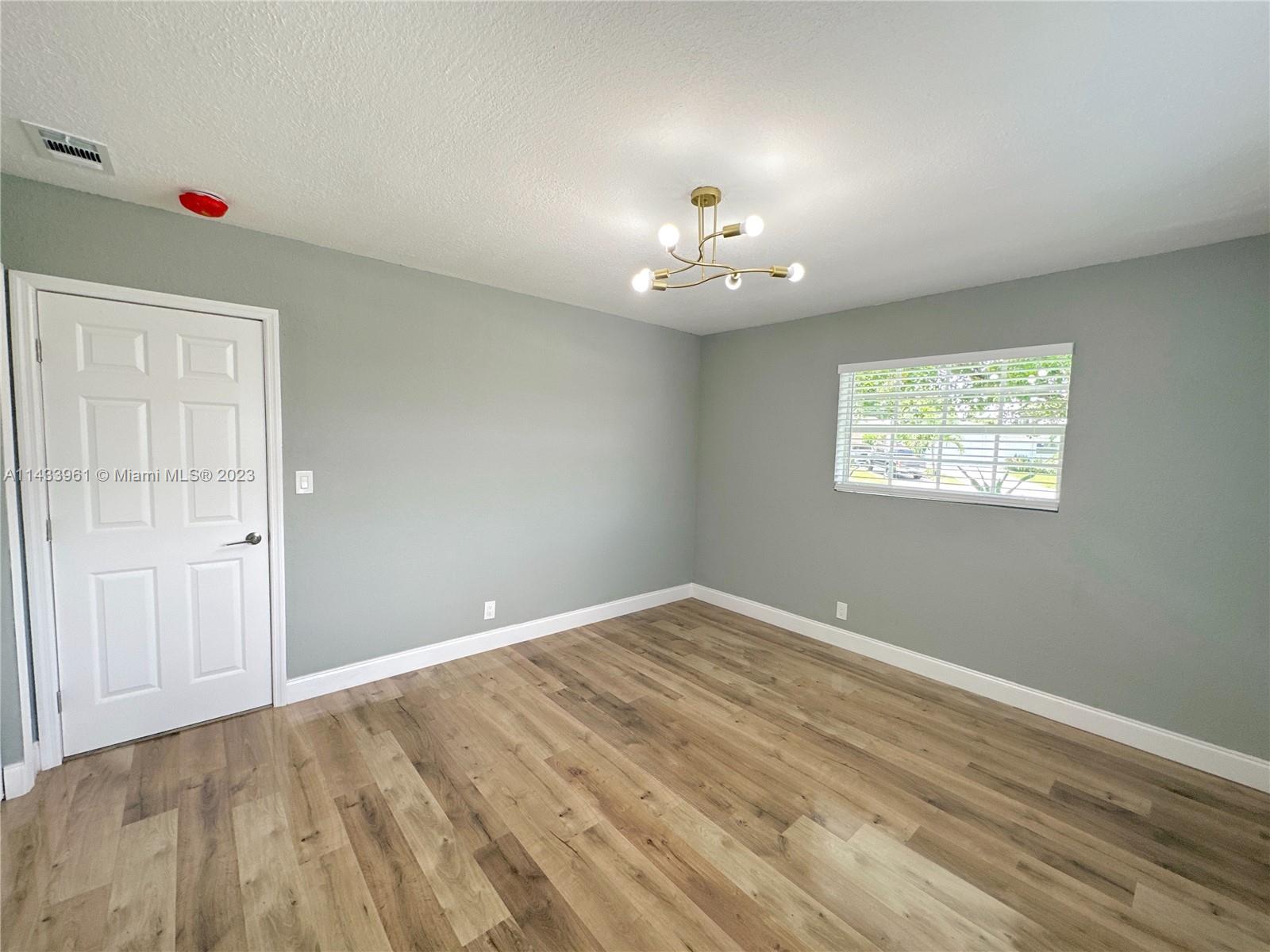 1460 Southwest 3rd Terrace Deerfield Beach, FL 33441 - Photo 48 of 100 a view of an empty room with a window