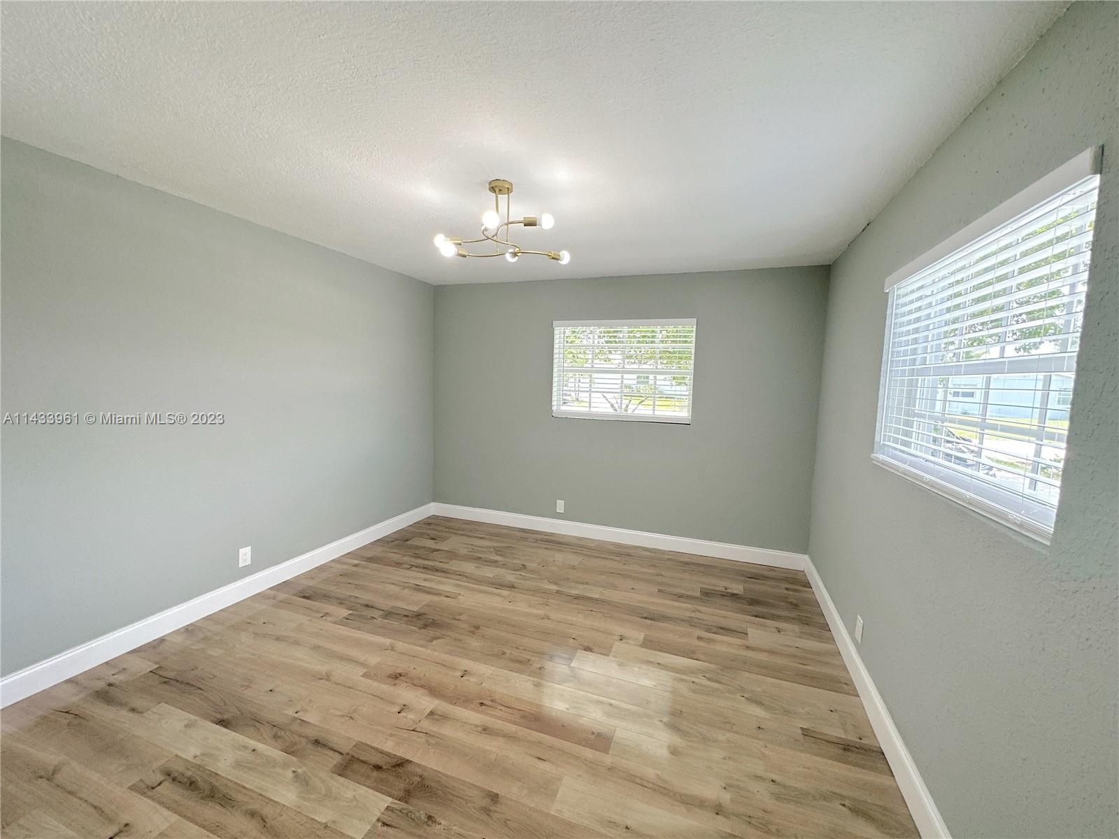 1460 Southwest 3rd Terrace Deerfield Beach, FL 33441 - Photo 49 of 100 a view of an empty room with a window