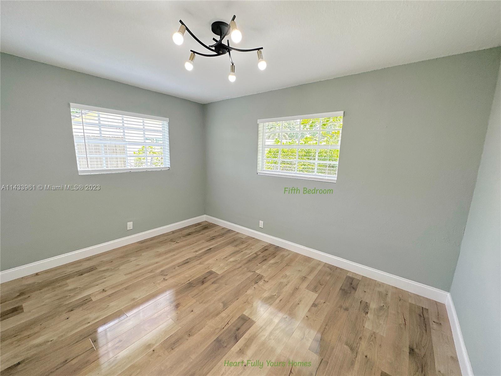 1460 Southwest 3rd Terrace Deerfield Beach, FL 33441 - Photo 64 of 100 a view of empty room with windows