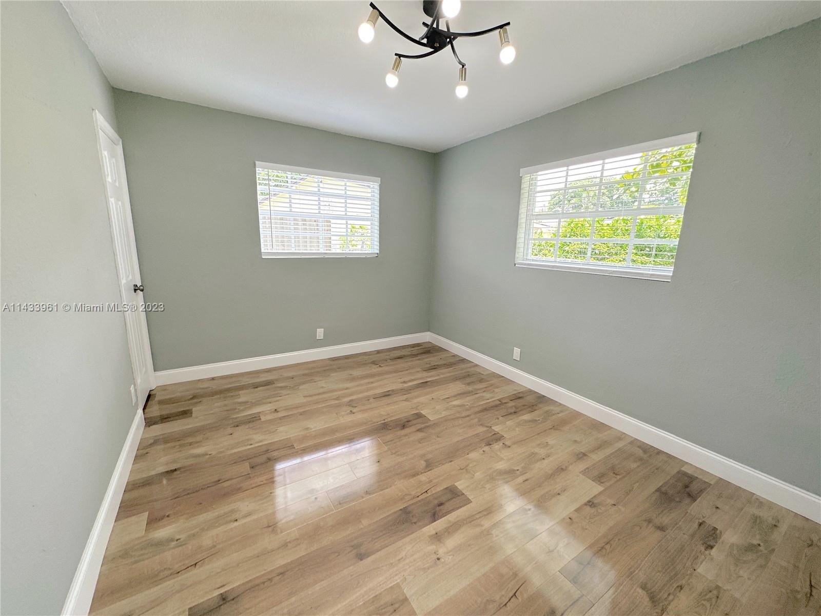 1460 Southwest 3rd Terrace Deerfield Beach, FL 33441 - Photo 65 of 100 a view of an empty room with a window