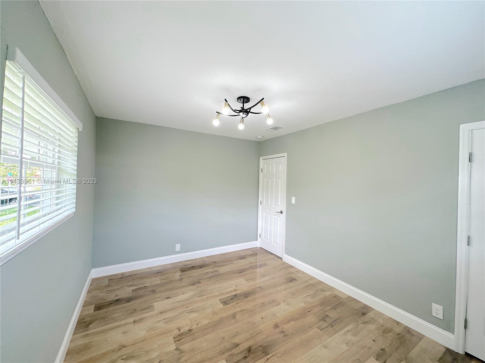 1460 Southwest 3rd Terrace Deerfield Beach, FL 33441 - Photo 69 of 100 a view of a room with a ceiling fan and a window