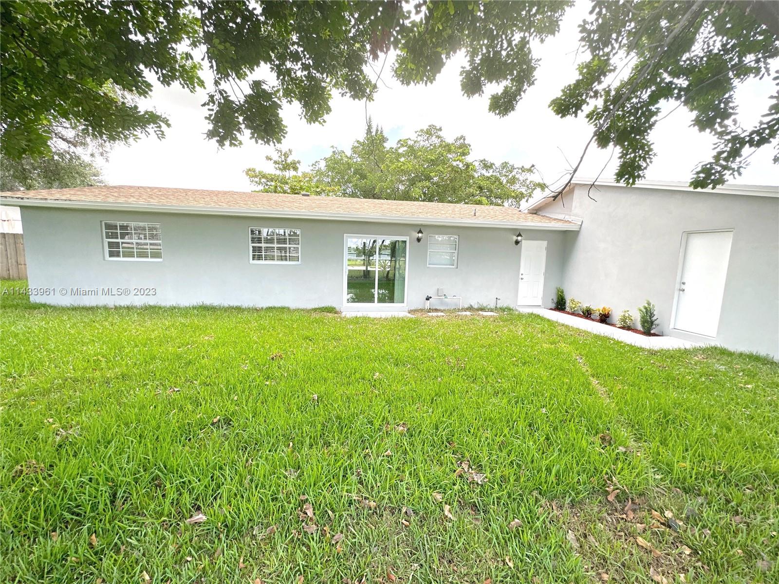 1460 Southwest 3rd Terrace Deerfield Beach, FL 33441 - Photo 78 of 100 a house view with a garden space