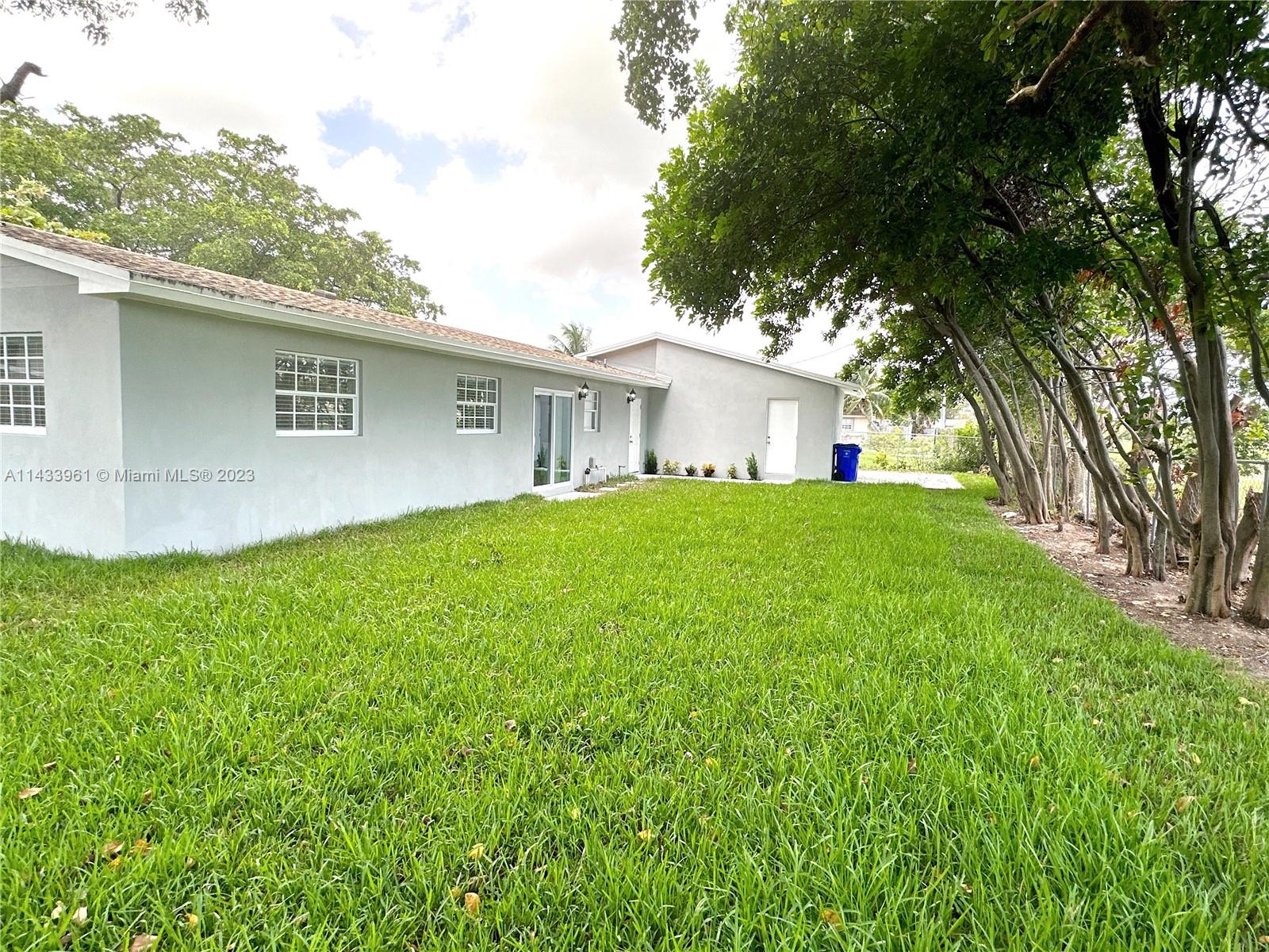 1460 Southwest 3rd Terrace Deerfield Beach, FL 33441 - Photo 79 of 100 a house view with a garden space