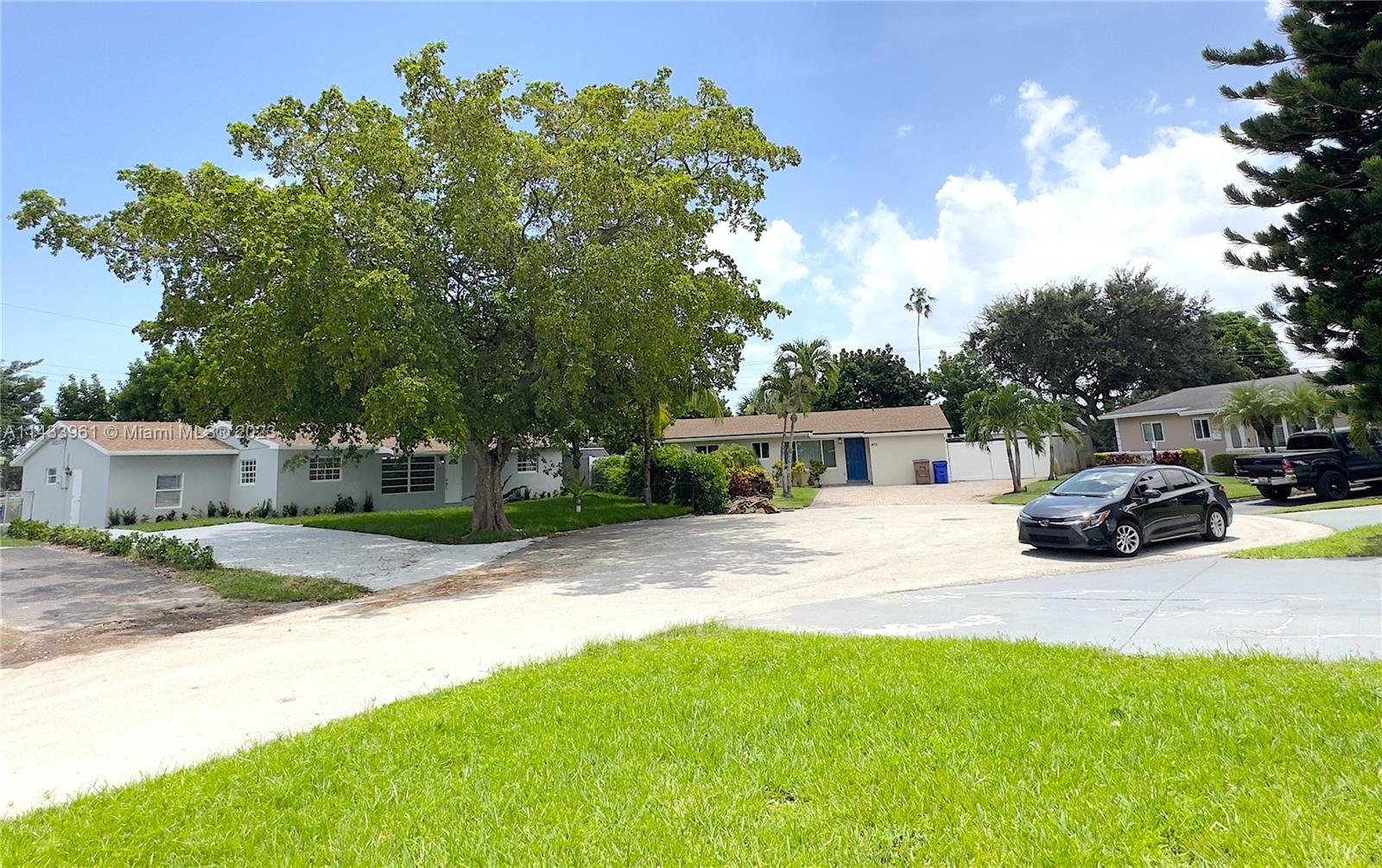 1460 Southwest 3rd Terrace Deerfield Beach, FL 33441 - Photo 100 of 100 a view of a house with backyard and sitting area