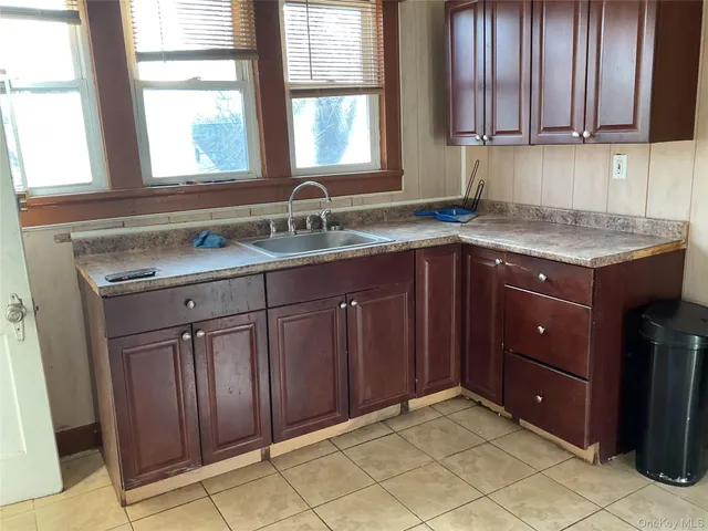 a kitchen with a sink and cabinets