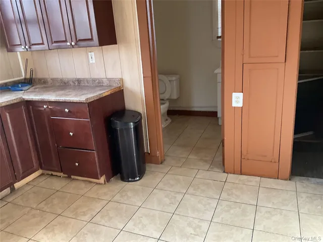 a kitchen with a cabinets and a stove top oven