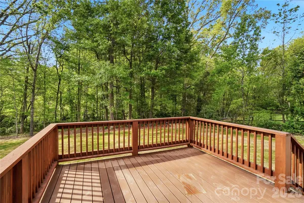 a view of balcony with wooden floor