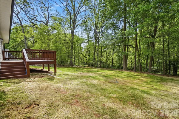 a view of a backyard with a table and chair