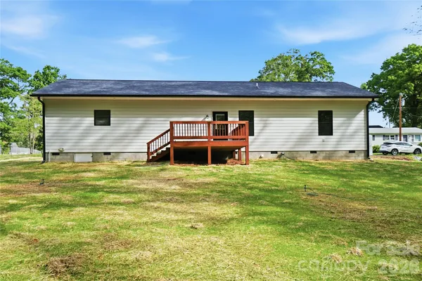 a front view of house with yard and trees