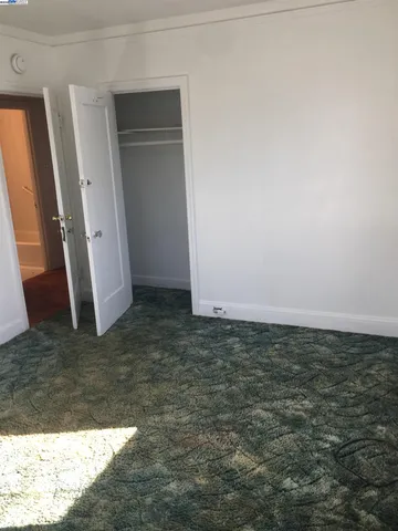 a view of a kitchen with a stove and cabinets
