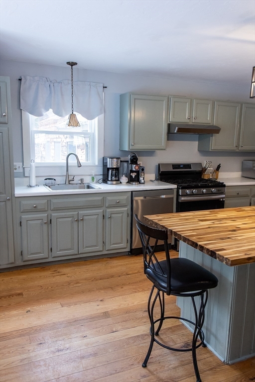 20 Paige Hill Road Brimfield, MA 01010 - Photo 13 of 40 a kitchen with stainless steel appliances granite countertop table chairs sink and cabinets