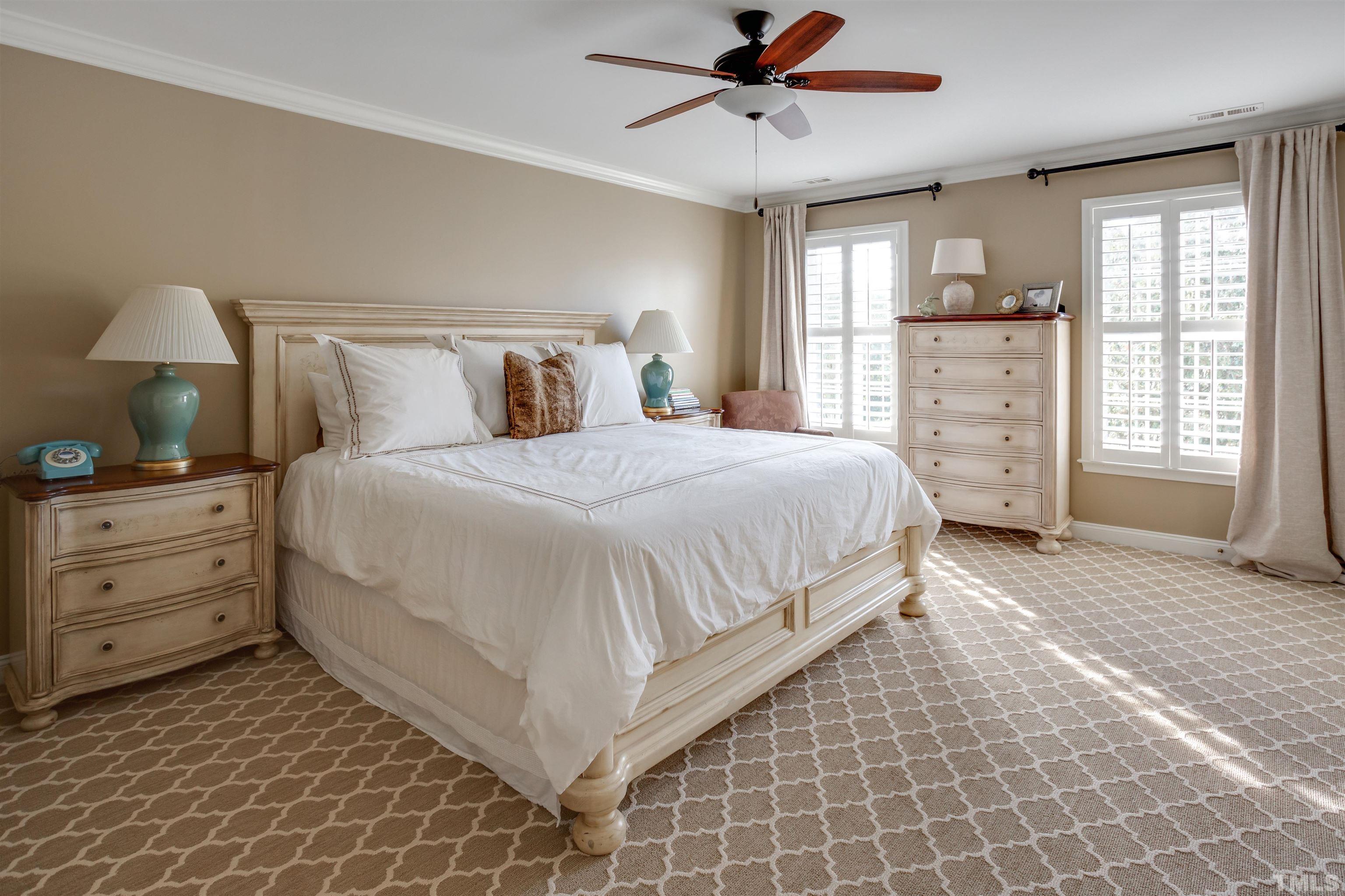 9004 Shellwood Court Raleigh, NC 27617 - Photo 14 of 30 a bedroom with a bed and a window