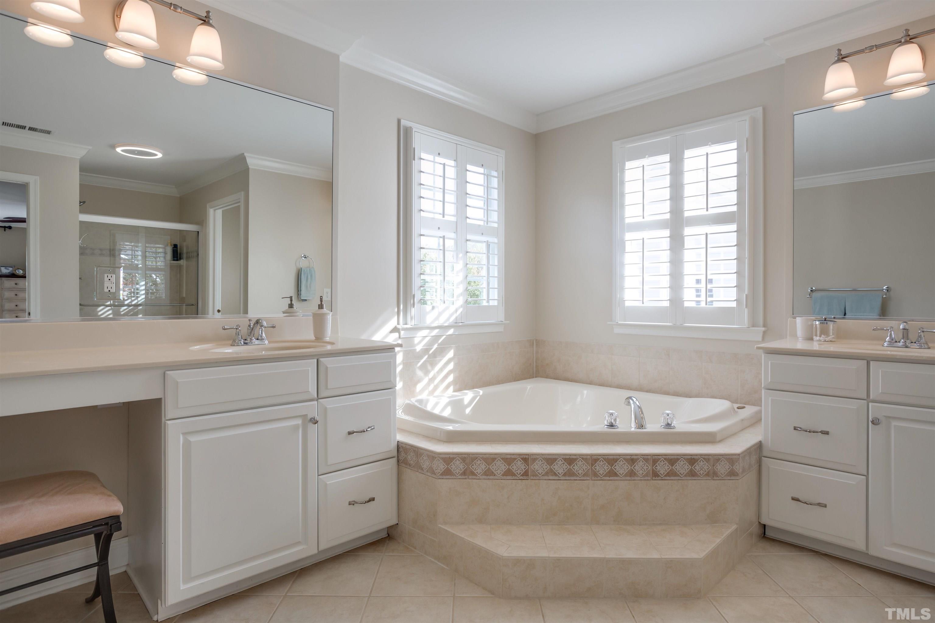 9004 Shellwood Court Raleigh, NC 27617 - Photo 15 of 30 a spacious bathroom with sink shower double vanity