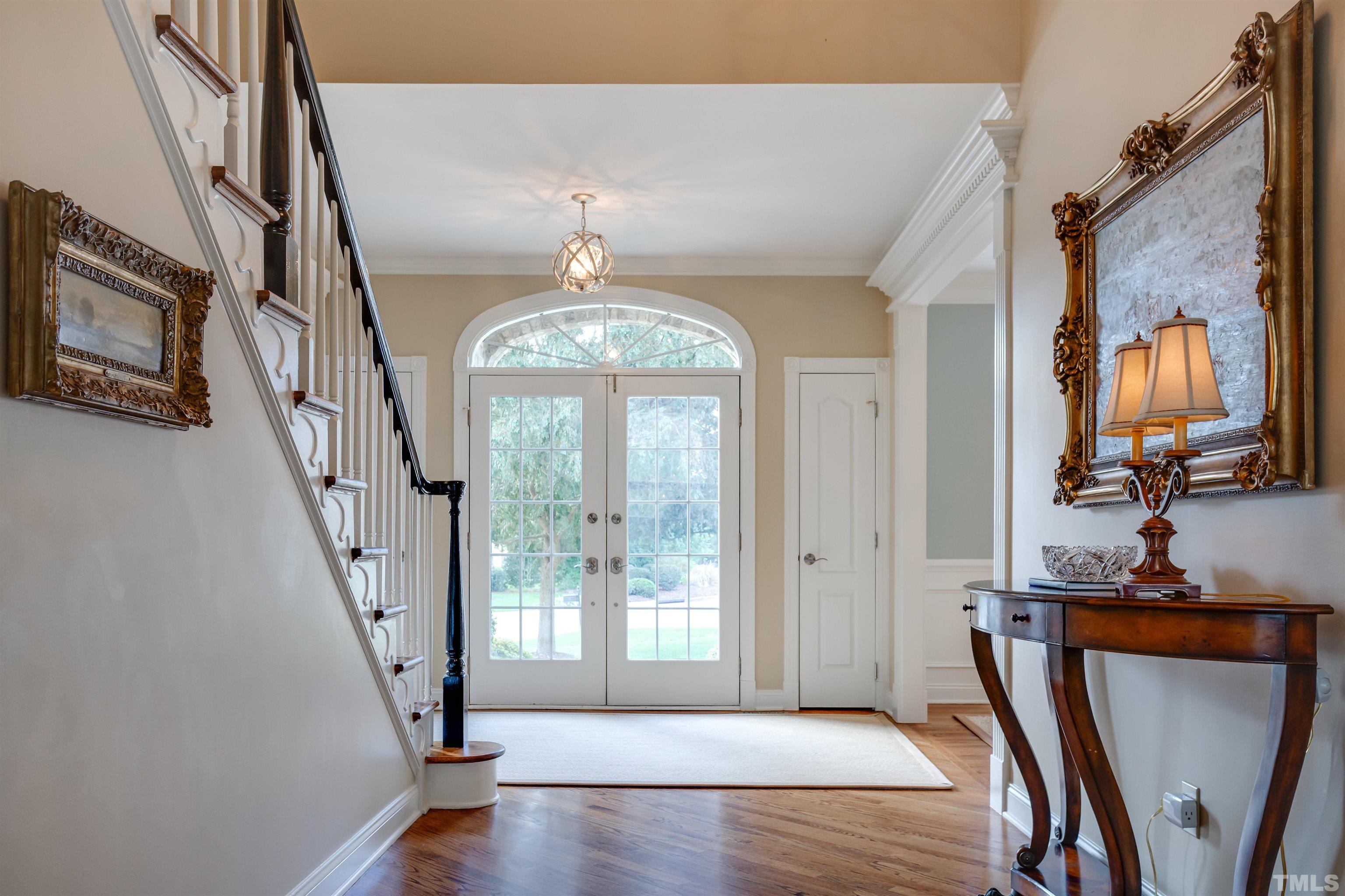 9004 Shellwood Court Raleigh, NC 27617 - Photo 3 of 30 a view of a livingroom with furniture staircase and front door