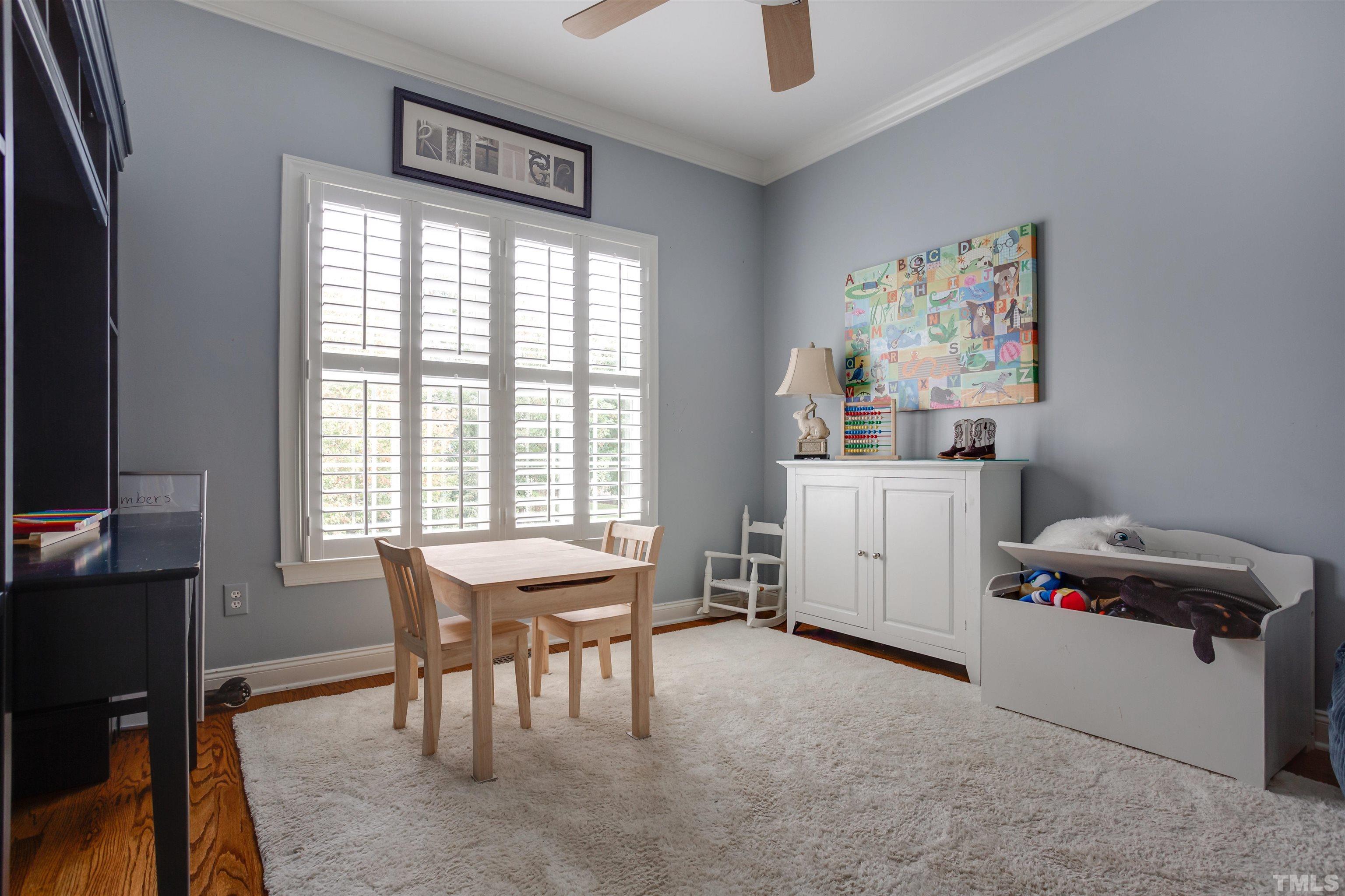 9004 Shellwood Court Raleigh, NC 27617 - Photo 21 of 30 a view of a workspace with furniture and a window