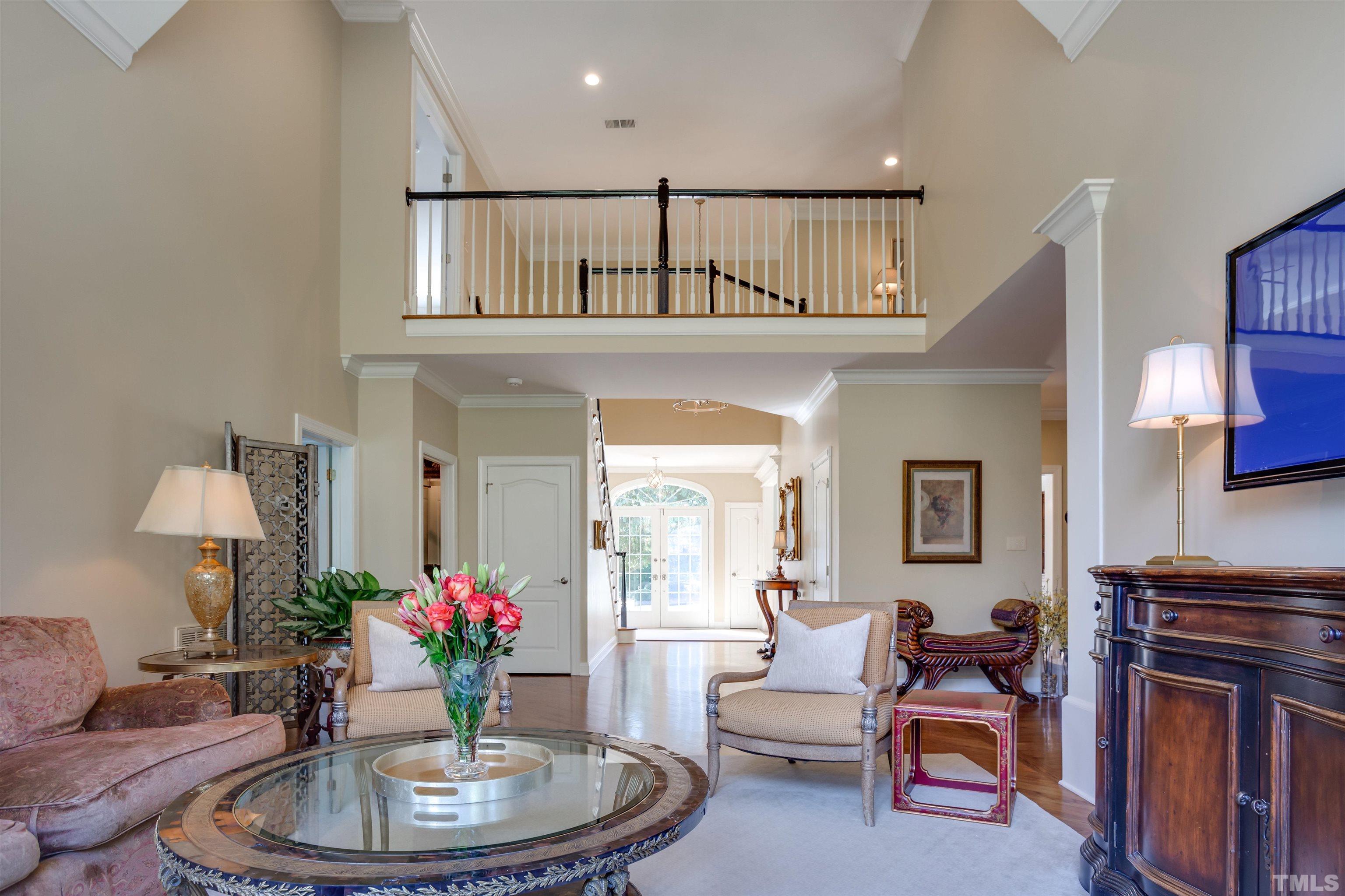 9004 Shellwood Court Raleigh, NC 27617 - Photo 4 of 30 a living room with furniture and a potted plant