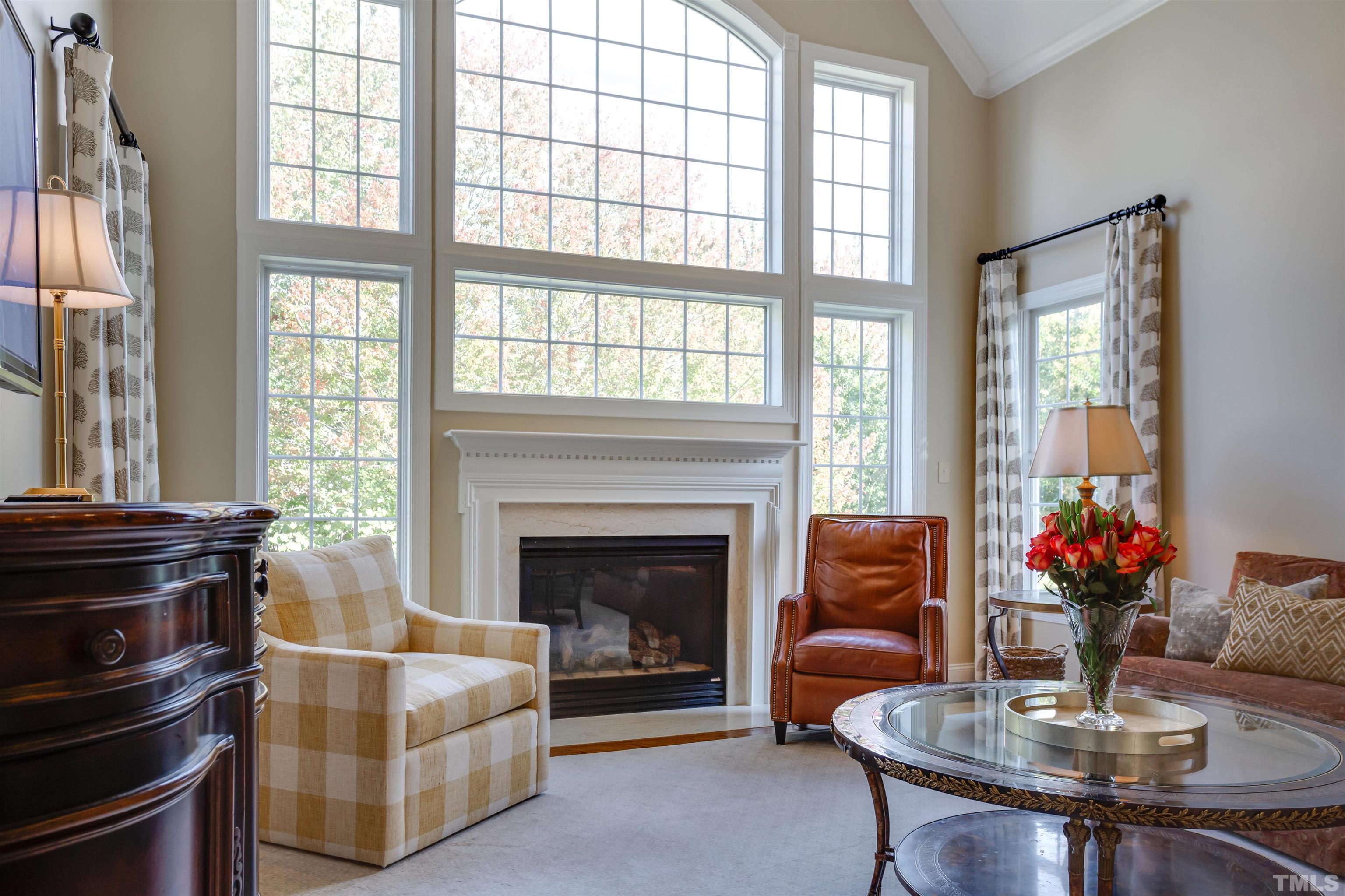 9004 Shellwood Court Raleigh, NC 27617 - Photo 6 of 30 a living room with furniture and a fireplace