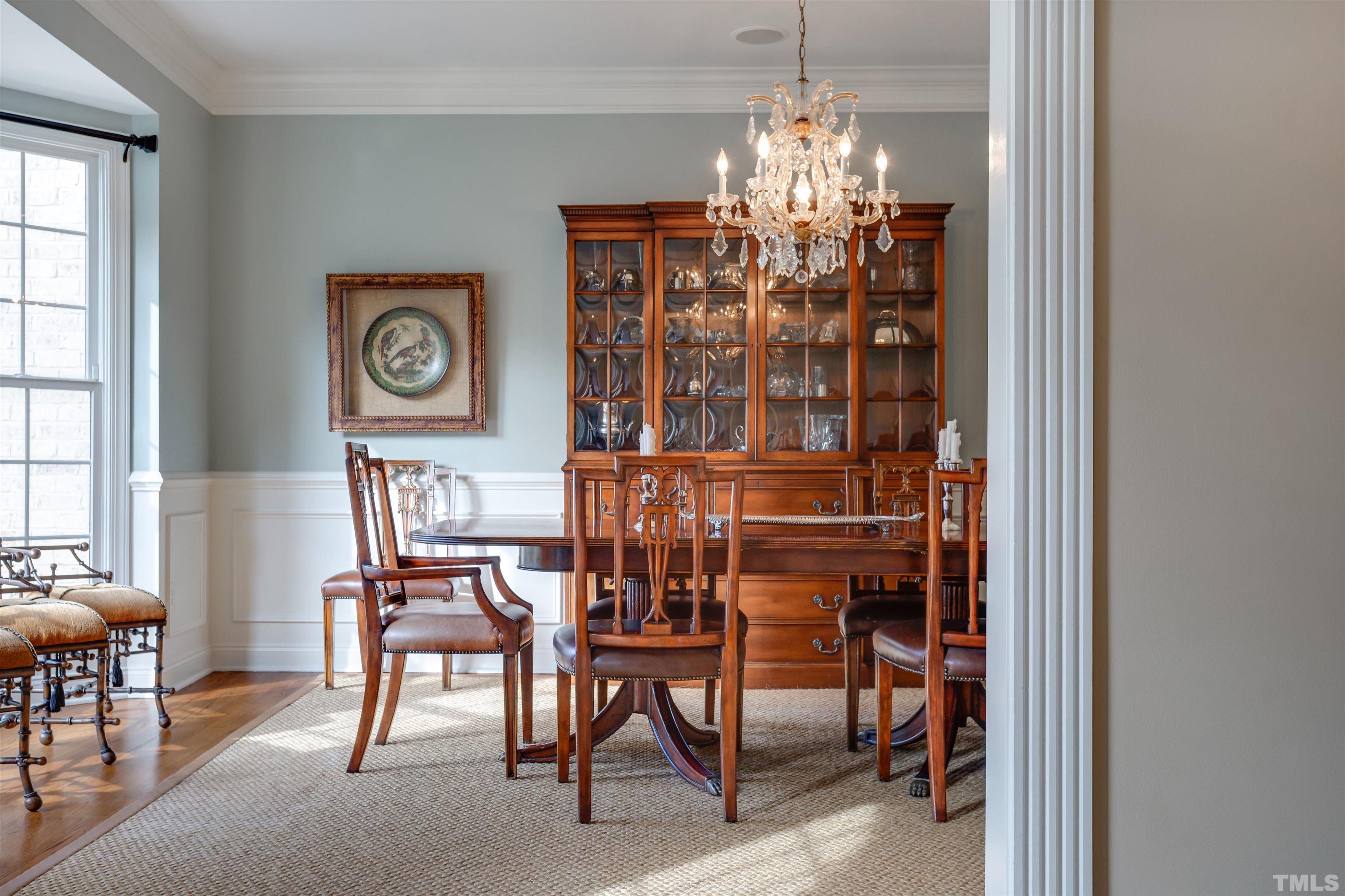 9004 Shellwood Court Raleigh, NC 27617 - Photo 7 of 30 a view of a dining room with furniture and chandelier