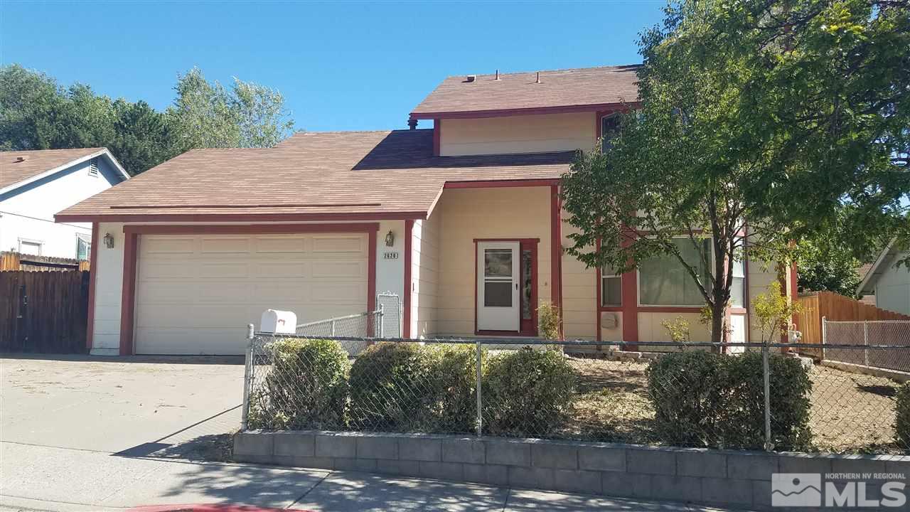 2620 Keystone Avenue Reno, NV 89503 - Photo 1 of 34 a front view of a house with garden