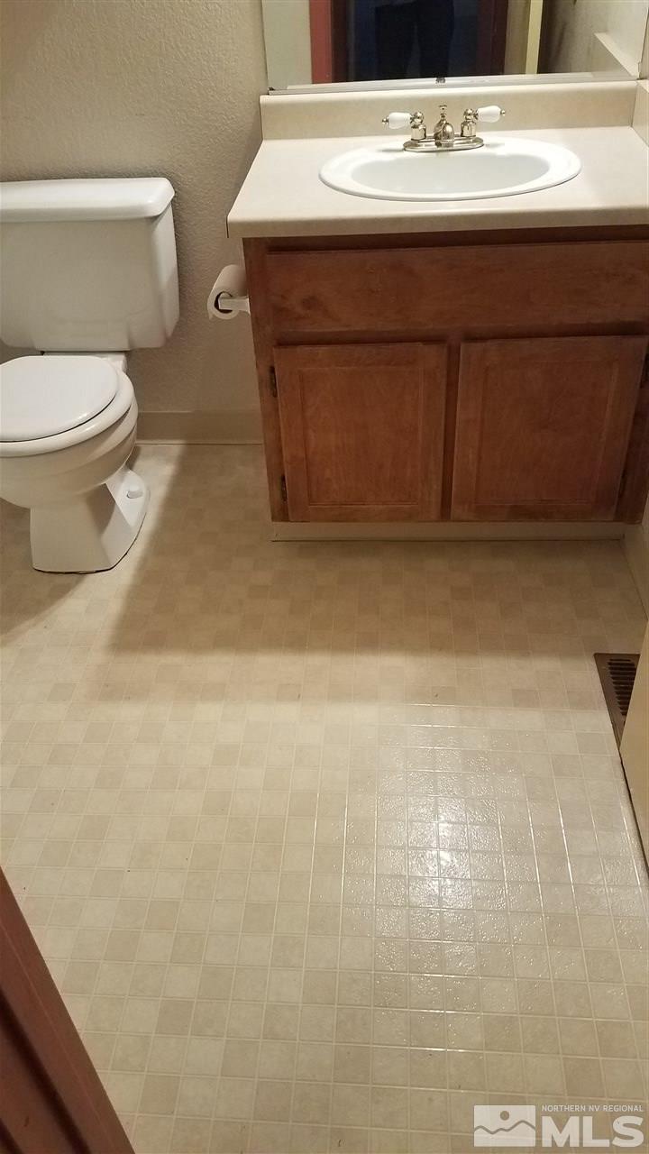 2620 Keystone Avenue Reno, NV 89503 - Photo 19 of 34 a bathroom with a sink a toilet and a mirror