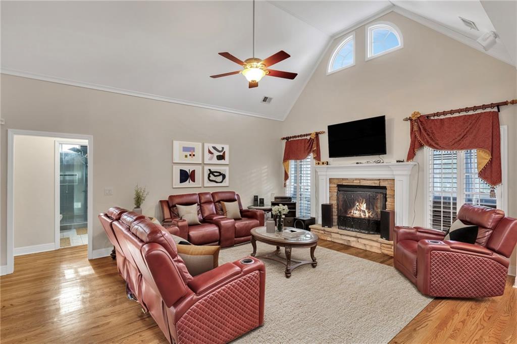 211 Graymist Path Southwest Loganville, GA 30052 - Photo 12 of 65 a living room with furniture fireplace and flat screen tv