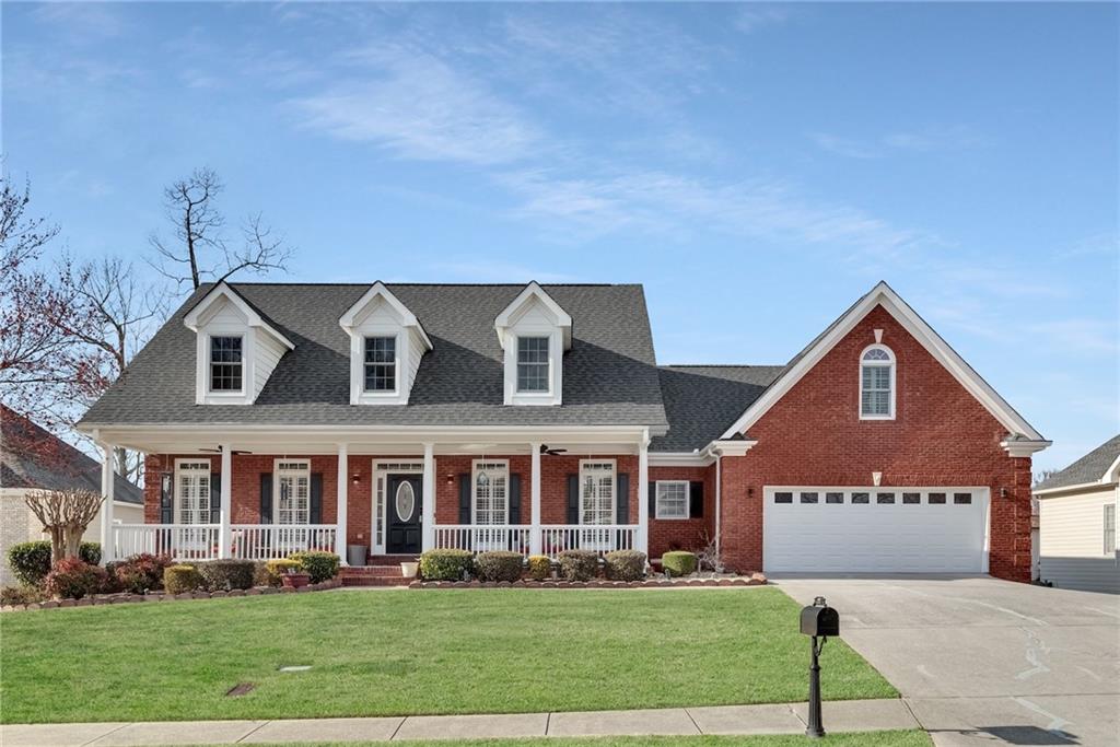 211 Graymist Path Southwest Loganville, GA 30052 - Photo 2 of 65 a front view of a house with a yard