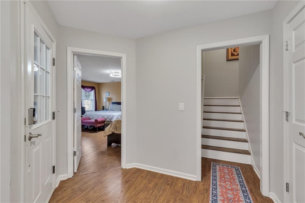 211 Graymist Path Southwest Loganville, GA 30052 - Photo 38 of 65 a view of a hallway view with wooden floor and closet