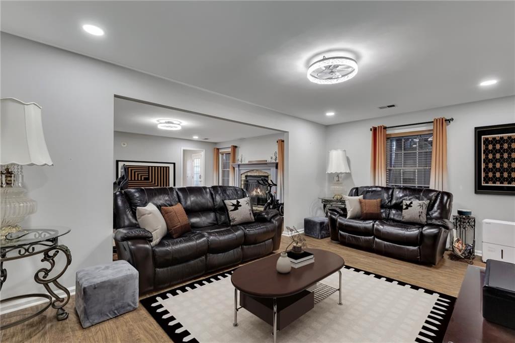 211 Graymist Path Southwest Loganville, GA 30052 - Photo 39 of 65 a living room with furniture a rug and a table