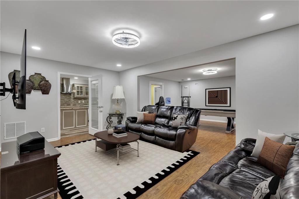 211 Graymist Path Southwest Loganville, GA 30052 - Photo 40 of 65 a living room with furniture a fireplace and a flat screen tv