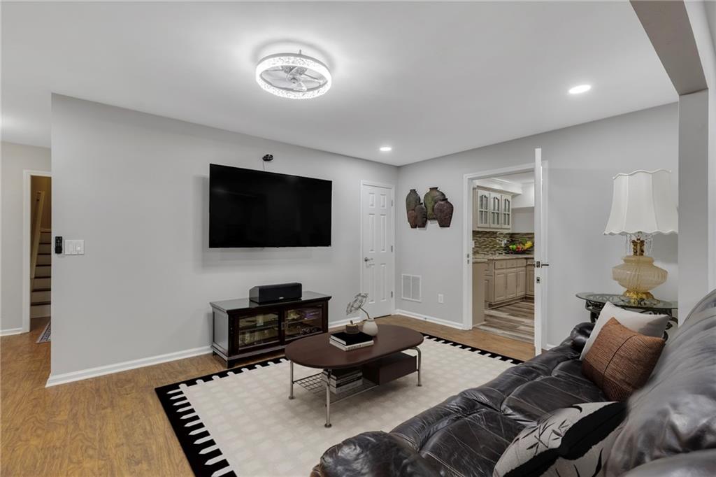 211 Graymist Path Southwest Loganville, GA 30052 - Photo 41 of 65 a living room with furniture and a flat screen tv