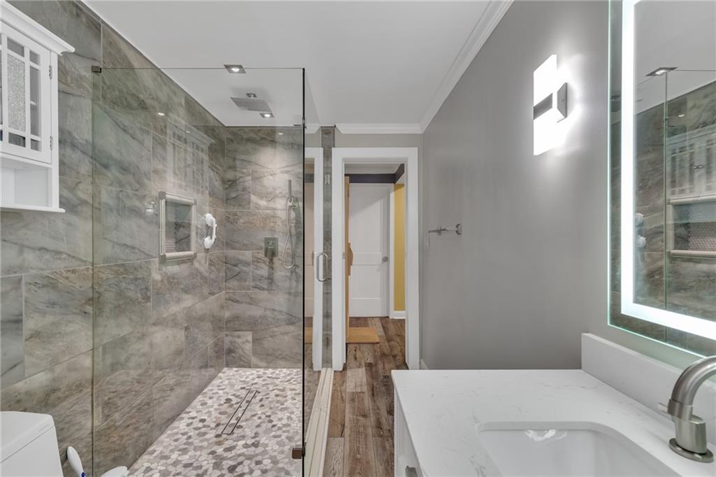 211 Graymist Path Southwest Loganville, GA 30052 - Photo 49 of 65 a bathroom with a sink a toilet and shower