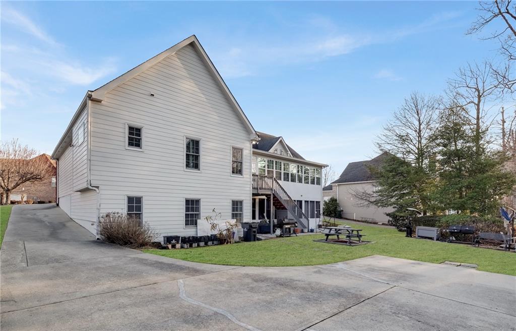 211 Graymist Path Southwest Loganville, GA 30052 - Photo 59 of 65 a view of a house with a yard and large tree