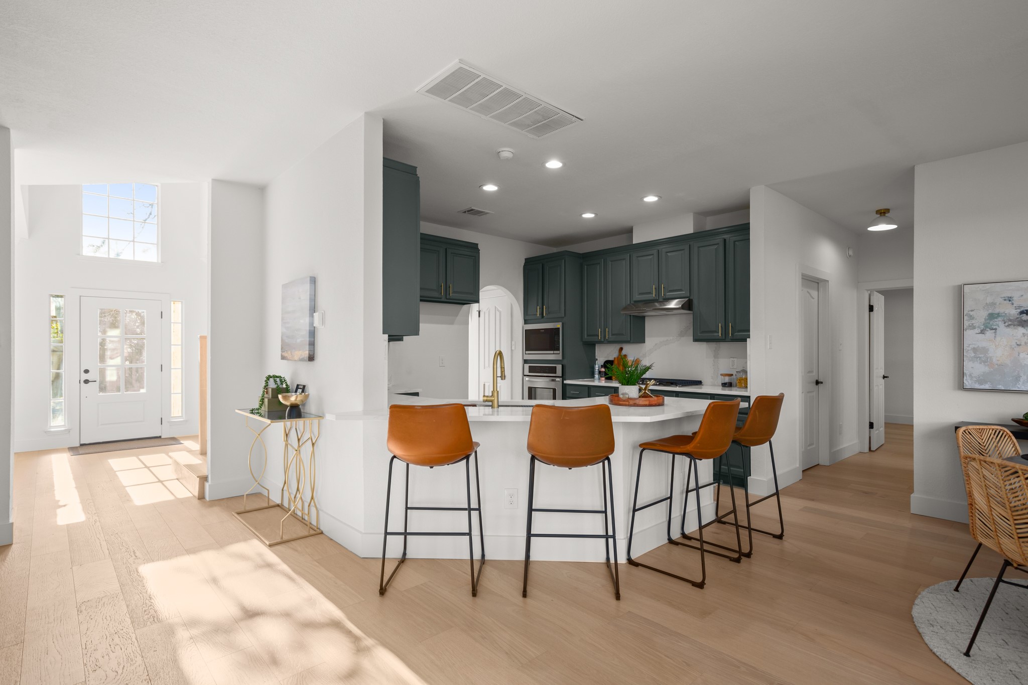 2022 Inverness Drive Round Rock, TX 78681 - Photo 14 of 38 a kitchen with a sink and chairs