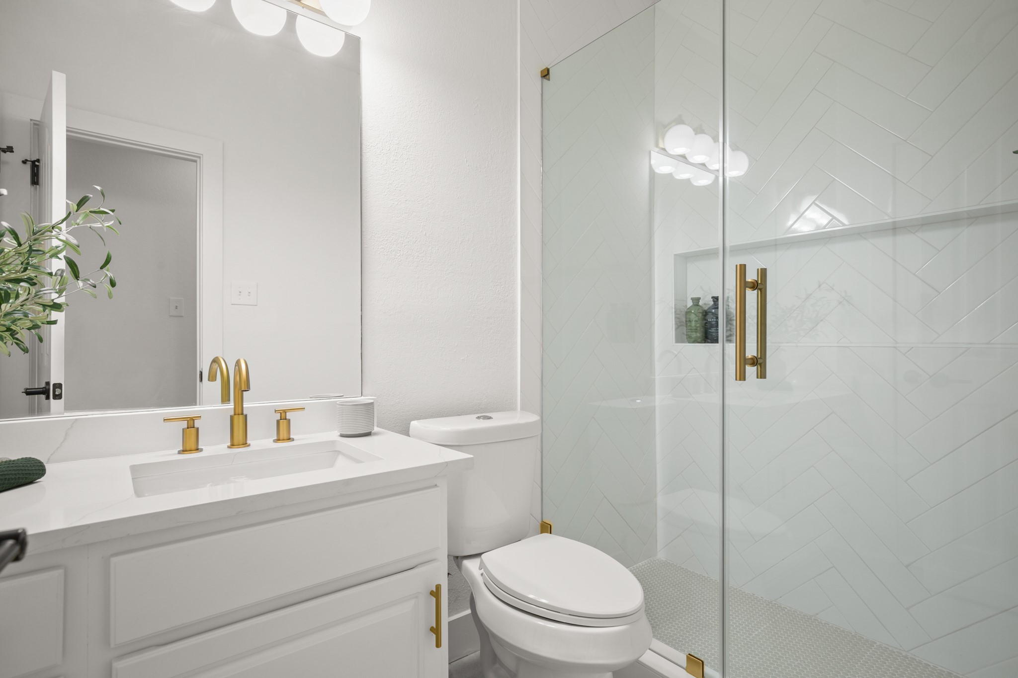 2022 Inverness Drive Round Rock, TX 78681 - Photo 19 of 38 a bathroom with a toilet sink and shower