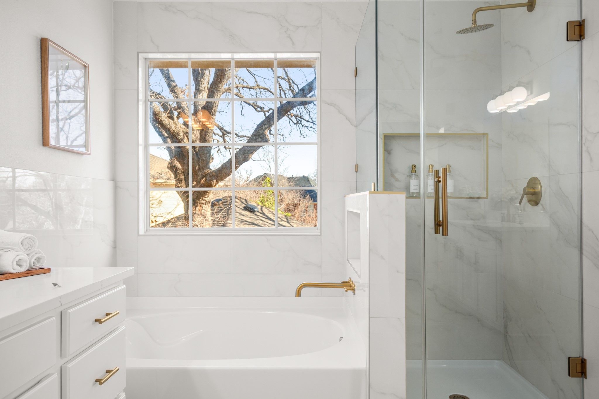 2022 Inverness Drive Round Rock, TX 78681 - Photo 26 of 38 a bathroom with a bathtub a shower and a sink
