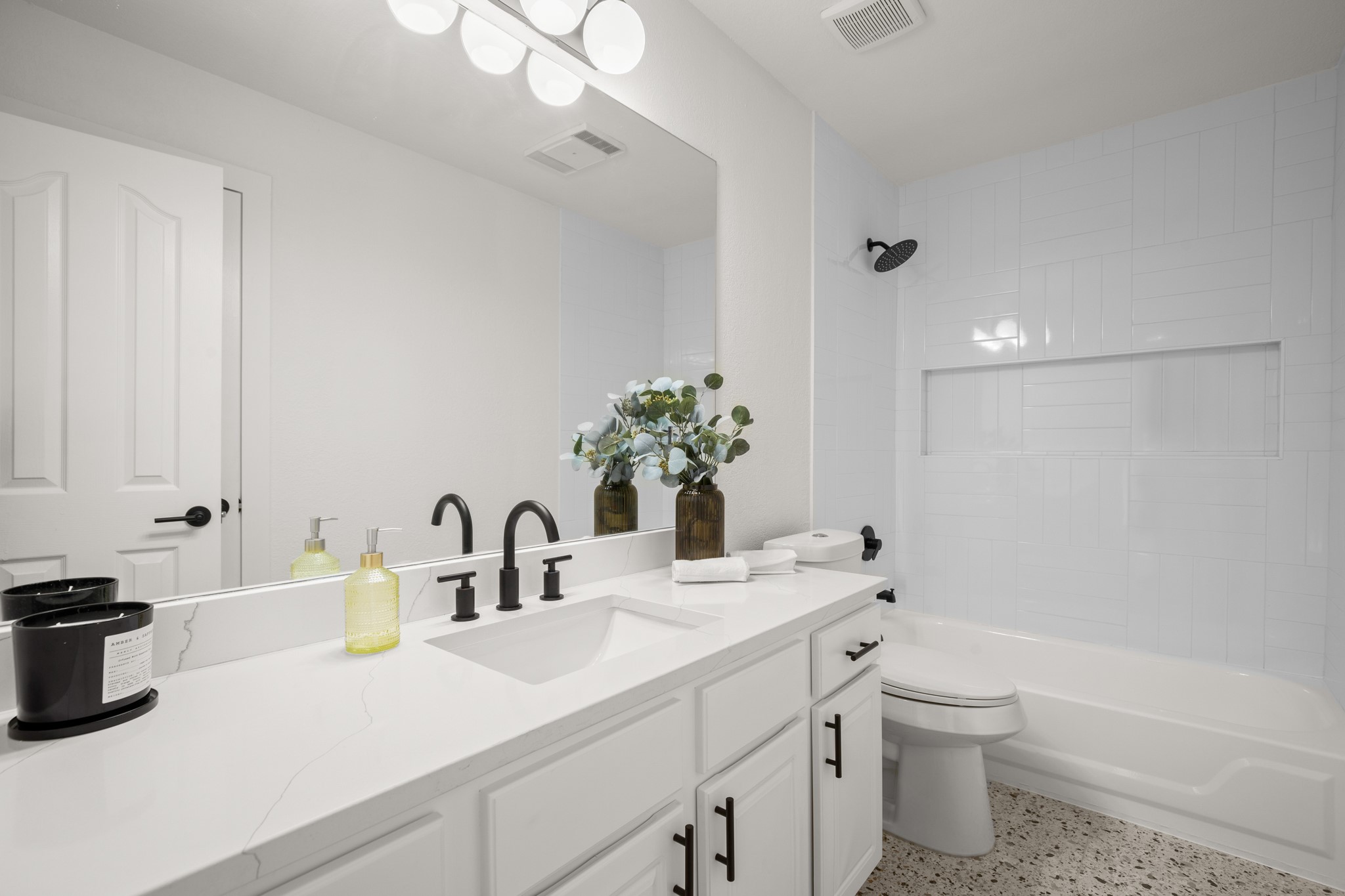 2022 Inverness Drive Round Rock, TX 78681 - Photo 31 of 38 a bathroom with a double vanity sink toilet and shower